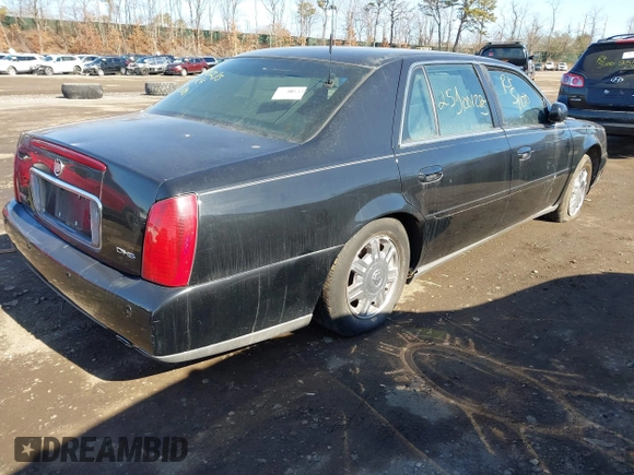 2004 Cadillac DeVille DHS z VIN 1G6KE57YX4U261849, wystawiony jako IAAI lot #41518835 z przebiegiem Nie podano mil oraz . Historia ofert i sprzedaży dostępna na DreamBid. Obrazek 4.