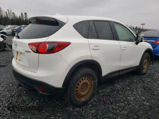 2014 Mazda CX-5 Touring z VIN JM3KE4CY1E0406726, wystawiony jako Copart lot #54652065 z przebiegiem 245 491 mil mil oraz Szkoda całkowita • Salvage title. Historia ofert i sprzedaży dostępna na DreamBid. Obrazek 3.