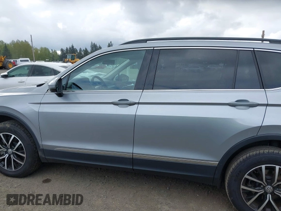 2021 Volkswagen Tiguan SE with VIN 3VV3B7AX0MM008809, listed as a IAAI auction lot 42077986 with 70,780 mi miles and . Bid and sale history available at DreamBid. Image 14.