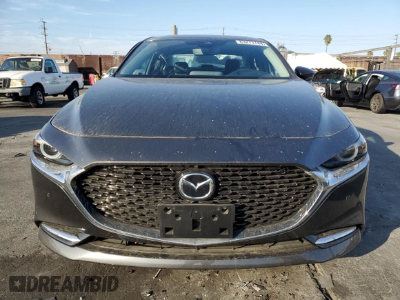 2023 Mazda 3 Premium Plus with VIN 3MZBPBEY2PM377464, listed as a Copart auction lot 83273744 with 6,299 mi miles and Salvage Title. Bid and sale history available at DreamBid. Image 4.