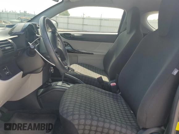 2014 Scion iQ with VIN JTNJJXB07EJ028558, listed as a Copart auction lot 64745345 with 112,221 mi miles and Clean title. Bid and sale history available at DreamBid. Image 7.