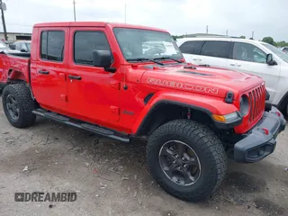 2021 Jeep Gladiator Rubicon z VIN 1C6JJTBG9ML569289, wystawiony jako IAAI lot #42206975 z przebiegiem 61 477 mil mil oraz . Historia ofert i sprzedaży dostępna na DreamBid. Obrazek 1.