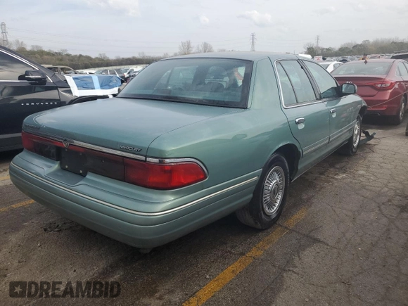 1997 Mercury Grand Marquis GS z VIN 2MELM74W7VX687221, wystawiony jako Copart lot #78665224 z przebiegiem 226 077 mil mil oraz Szkoda całkowita • Salvage title. Historia ofert i sprzedaży dostępna na DreamBid. Obrazek 3.
