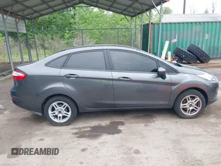 2019 Ford Fiesta SE z VIN 3FADP4BJ7KM155094, wystawiony jako IAAI lot #42186126 z przebiegiem 93 684 mil mil oraz . Historia ofert i sprzedaży dostępna na DreamBid. Obrazek 13.
