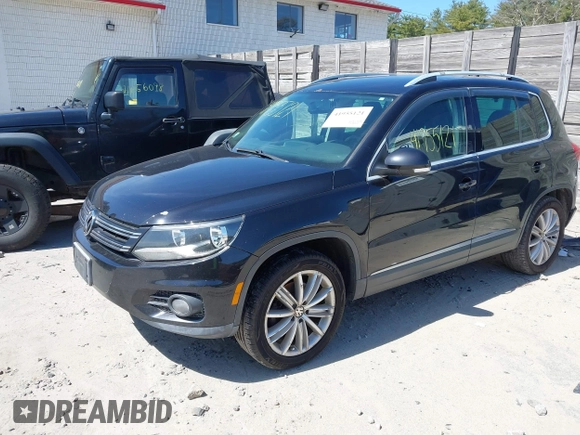 2012 Volkswagen Tiguan SEL with VIN WVGAV7AX2CW529232, listed as a IAAI auction lot 41955121 with 164,885 mi miles and . Bid and sale history available at DreamBid. Image 17.
