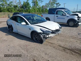 2023 Tesla Model 3 with VIN 5YJ3E1EA9PF557880, listed as a IAAI auction lot 42481413 with 40,582 mi miles and . Bid and sale history available at DreamBid. Image 1.