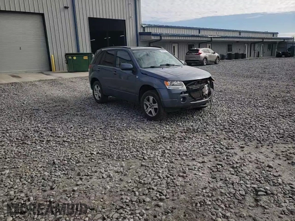 2007 Suzuki Grand Vitara Luxury z VIN JS3TD947774200407, wystawiony jako Copart lot #52001965 z przebiegiem Nie podano mil oraz Szkoda całkowita • Salvage title. Historia ofert i sprzedaży dostępna na DreamBid. Obrazek 11.