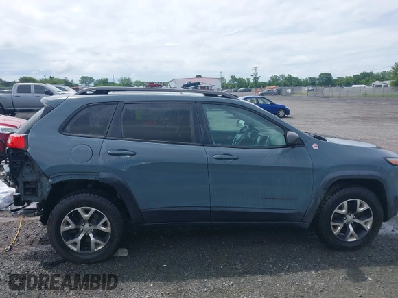 2014 Jeep Cherokee Trailhawk z VIN 1C4PJMBS4EW236950, wystawiony jako IAAI lot #42636128 z przebiegiem 170 491 mil mil oraz . Historia ofert i sprzedaży dostępna na DreamBid. Obrazek 14.