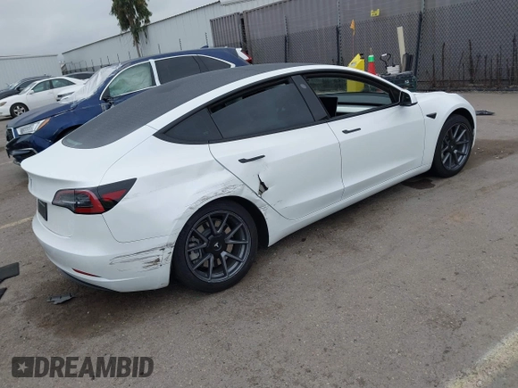 2023 Tesla Model 3 with VIN 5YJ3E1EA5PF505856, listed as a IAAI auction lot 41885837 with 28,206 mi miles and . Bid and sale history available at carsss.com. Image 4.