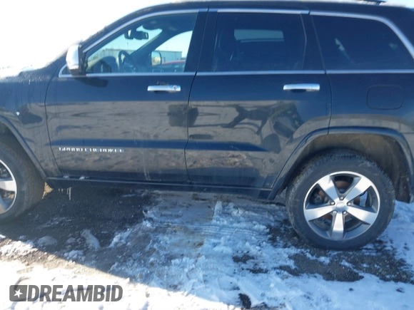 2015 Jeep Grand Cherokee Overland z VIN 1C4RJFCG3FC726748, wystawiony jako IAAI lot #41369715 z przebiegiem 120 905 mil mil oraz . Historia ofert i sprzedaży dostępna na DreamBid. Obrazek 14.