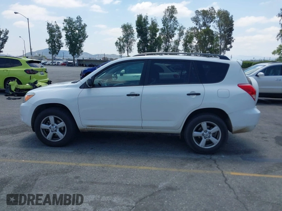 2007 Toyota RAV4 with VIN JTMZK33V875013053, listed as a IAAI auction lot 42133759 with 142,572 mi miles. Bid and sale history available at carsss.com. Image 14.