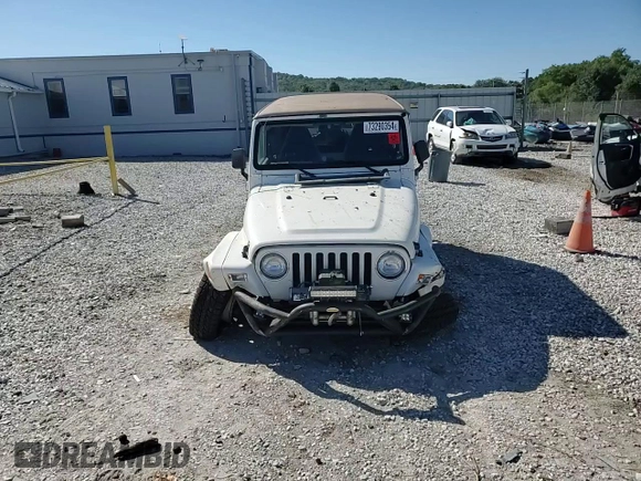 2000 Jeep Wrangler Sahara with VIN 1J4FA59SXYP764539, listed as a Copart auction lot 52707385 with 136,159 mi miles and Salvage title. Bid and sale history available at DreamBid. Image 11.
