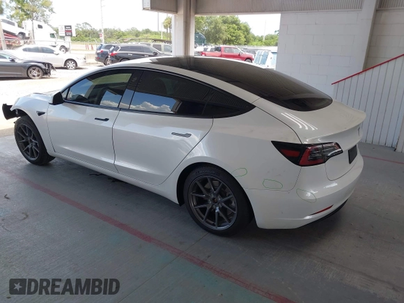 2023 Tesla Model 3 z VIN 5YJ3E1EAXPF606178, wystawiony jako IAAI lot #42543528 z przebiegiem 26 638 mil mil oraz . Historia ofert i sprzedaży dostępna na DreamBid. Obrazek 3.