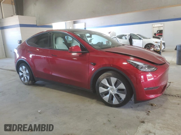 2024 Tesla Model Y Long Range with VIN 7SAYGDEE6RF995069, listed as a Copart auction lot 57085405 with 22,302 mi miles and Salvage title. Bid and sale history available at DreamBid. Image 4.