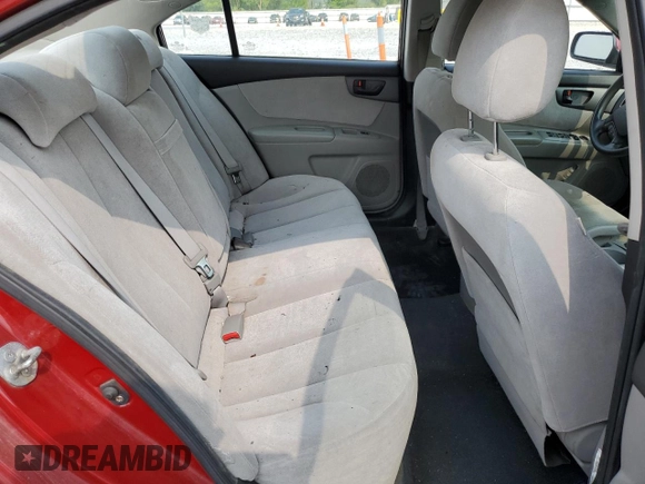 2009 Kia Optima LX z VIN KNAGE228795334599, wystawiony jako Copart lot #59276515 z przebiegiem 180 399 mil mil oraz Szkoda całkowita • Salvage title. Historia ofert i sprzedaży dostępna na DreamBid. Obrazek 10.