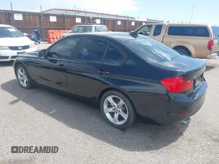2014 BMW 3 Series 328i xDrive with VIN WBA3B3C56EJ981322, listed as a IAAI auction lot 42104530 with 104,376 mi miles. Bid and sale history available at carsss.com. Image 3.