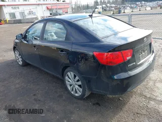 2010 Kia Forte SX with VIN KNAFW4A39A5054469, listed as a IAAI auction lot 41526636 with 115,008 mi miles. Bid and sale history available at carsss.com. Image 3.