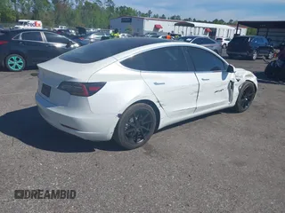 2019 Tesla Model 3 Mid Range with VIN 5YJ3E1EA7KF425127, listed as a IAAI auction lot 41886436 with 87,236 mi miles and . Bid and sale history available at carsss.com. Image 4.