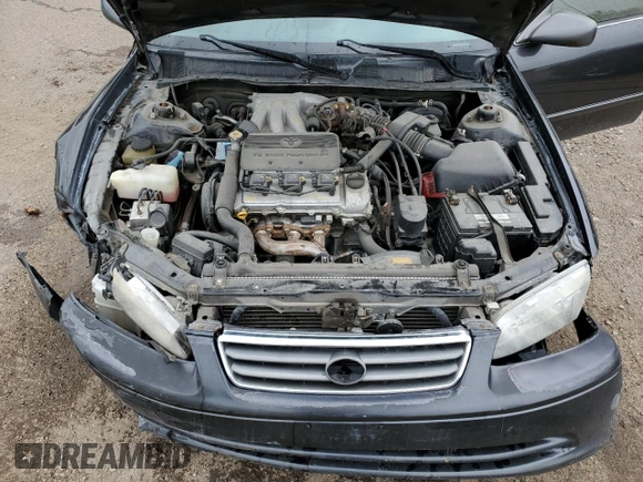 2001 Toyota Camry LE z VIN JT2BF22K010295564, wystawiony jako Copart lot #55111755 z przebiegiem 379 337 mil mil oraz Szkoda całkowita • Salvage title. Historia ofert i sprzedaży dostępna na DreamBid. Obrazek 11.