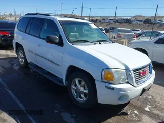 2002 GMC Envoy SLT with VIN 1GKDT13S722281544, listed as a IAAI auction lot 41837068 with 130,994 mi miles. Bid and sale history available at carsss.com. Image 1.