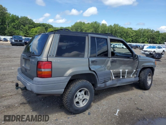 1997 Jeep Grand Cherokee Laredo with VIN 1J4GZ58S7VC505069, listed as a Copart auction lot 63255945 with 127,552 mi miles and Salvage title. Bid and sale history available at DreamBid. Image 3.