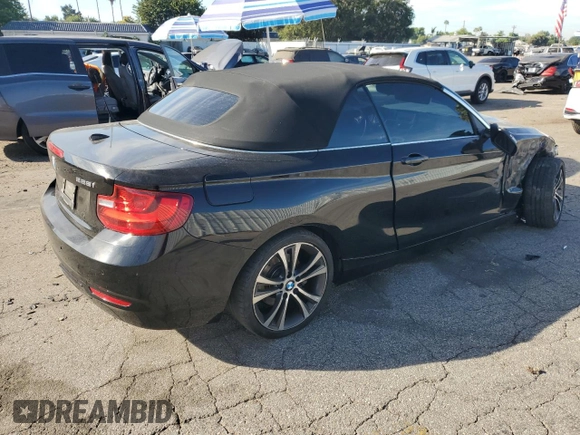 2015 BMW 2 Series 228i with VIN WBA1K5C59FV242992, listed as a Copart auction lot 75433654 with Not provided miles and Salvage title. Bid and sale history available at DreamBid. Image 3.
