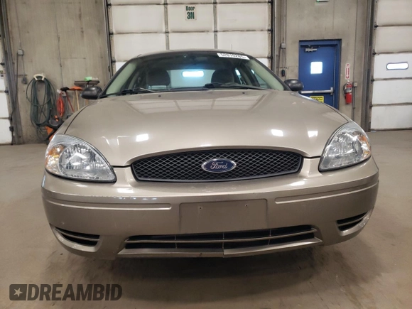 2005 Ford Taurus SE with VIN 1FAFP53U15A276082, listed as a Copart auction lot 52015285 with 103,479 mi miles and Salvage Title. Bid and sale history available at carsss.com. Image 5.