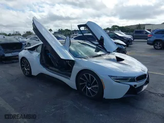 2015 BMW i8 with VIN WBY2Z2C51FV392661, listed as a IAAI auction lot 38409147 with 79,082 mi miles. Bid and sale history available at carsss.com. Image 1.