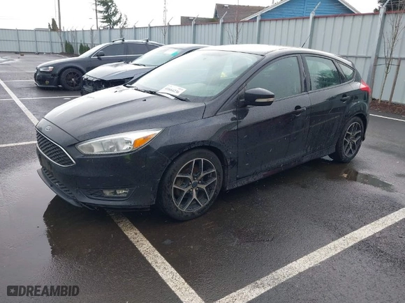 2015 Ford Focus SE with VIN 1FADP3K24FL370068, listed as a IAAI auction lot 41664236 with 328,569 mi miles. Bid and sale history available at carsss.com. Image 2.