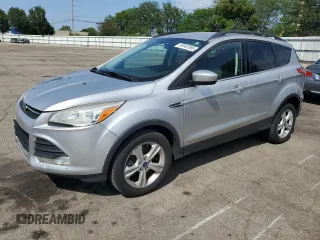 2014 Ford Escape SE with VIN 1FMCU9GX3EUB19987, listed as a Copart auction lot 64042695 with 96,775 mi miles and Salvage title. Bid and sale history available at DreamBid. Image 1.