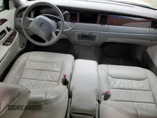 1999 Lincoln Town Car Executive z VIN 1LNHM81W7XY699742, wystawiony jako Copart lot #44360135 z przebiegiem 96 325 mil mil oraz Szkody całkowita. Historia ofert i sprzedaży dostępna na DreamBid. Obrazek 8.