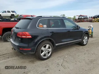 2012 Volkswagen Touareg Sport with VIN WVGFF9BP8CD001039, listed as a Copart auction lot 57764125 with 128,540 mi miles and Clean title. Bid and sale history available at DreamBid. Image 3.