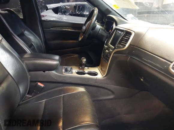 2015 Jeep Grand Cherokee Overland with VIN 1C4RJFCG1FC215426, listed as a IAAI auction lot 41689821 with 128,563 mi miles. Bid and sale history available at carsss.com. Image 5.
