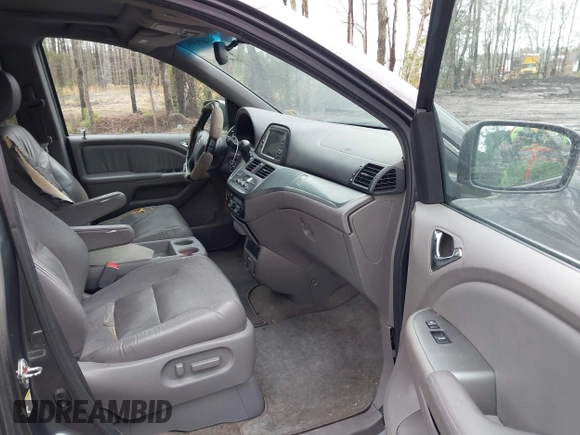 2010 Honda Odyssey EX-L with VIN 5FNRL3H75AB021480, listed as a IAAI auction lot 41793994 with 169,386 mi miles and . Bid and sale history available at DreamBid. Image 5.
