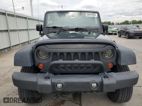 2013 Jeep Wrangler Unlimited Sport with VIN 1C4BJWDG0DL560265, listed as a Copart auction lot 58444045 with 111,354 mi miles and Salvage title. Bid and sale history available at DreamBid. Image 5.
