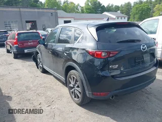 2018 Mazda CX-5 Touring z VIN JM3KFBCM9J0358997, wystawiony jako IAAI lot #42332606 z przebiegiem 93 952 mil mil oraz . Historia ofert i sprzedaży dostępna na DreamBid. Obrazek 3.