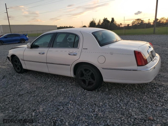 1999 Lincoln Town Car Signature with VIN 1LNHM82W4XY611874, listed as a Copart auction lot 73653694 with 182,791 mi miles and Salvage Title. Bid and sale history available at carsss.com. Image 2.