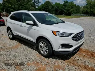 2020 Ford Edge SEL z VIN 2FMPK3J94LBA57940, wystawiony jako Copart lot #54901165 z przebiegiem 117 096 mil mil oraz Szkoda całkowita • Salvage title. Historia ofert i sprzedaży dostępna na DreamBid. Obrazek 13.