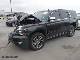2015 Chevrolet Tahoe LTZ with VIN 1GNSCCKC7FR614886, listed as a IAAI auction lot 41679585 with 104,695 mi miles. Bid and sale history available at carsss.com. Image 2.