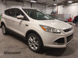 2016 Ford Escape Titanium with VIN 1FMCU9J99GUA61848, listed as a IAAI auction lot 42300324 with 51,692 mi miles and . Bid and sale history available at DreamBid. Image 1.