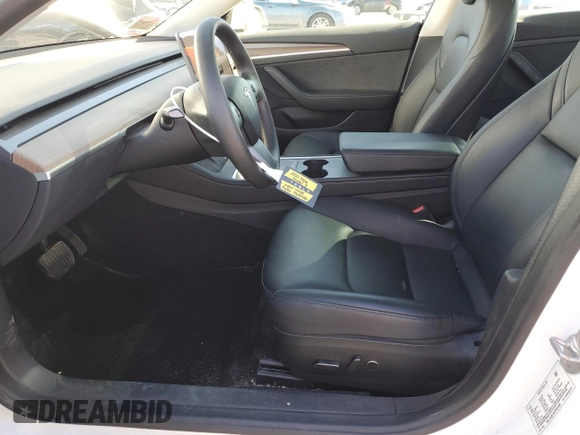 2023 Tesla Model 3 with VIN 5YJ3E1EA7PF557358, listed as a Copart auction lot 48891985 with 20,673 mi miles and Salvage title. Bid and sale history available at DreamBid. Image 7.