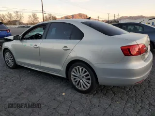 2012 Volkswagen Jetta Sedan SEL w/Sunroof with VIN 3VWLX7AJ7CM310458, listed as a Copart auction lot 87670525 with 142,944 mi miles and Salvage Title. Bid and sale history available at carsss.com. Image 2.