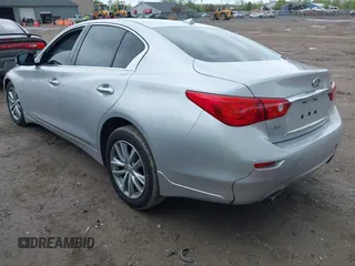 2015 Infiniti Q50 Premium z VIN JN1BV7AR8FM390785, wystawiony jako IAAI lot #42200437 z przebiegiem 94 841 mil mil oraz . Historia ofert i sprzedaży dostępna na DreamBid. Obrazek 3.