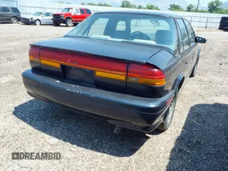 1994 Saturn SL z VIN 1G8ZJ557XRZ269410, wystawiony jako IAAI lot #31653894 z przebiegiem 132 202 mil mil oraz . Historia ofert i sprzedaży dostępna na DreamBid. Obrazek 4.