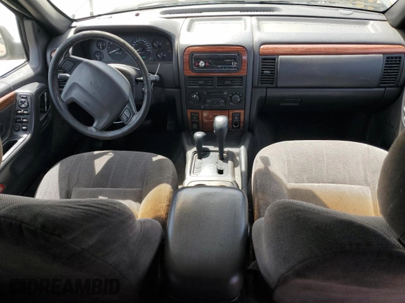 1999 Jeep Grand Cherokee Limited with VIN 1J4GW68N4XC663476, listed as a Copart auction lot 52449925 with 174,583 mi miles and Salvage Title. Bid and sale history available at carsss.com. Image 8.