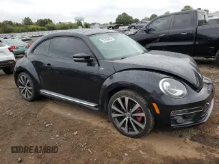 2014 Volkswagen Beetle Turbo R-Line with VIN 3VWVT7AT2EM603435, listed as a Copart auction lot 72755524 with 99,300 mi miles and Salvage Title. Bid and sale history available at DreamBid. Image 4.