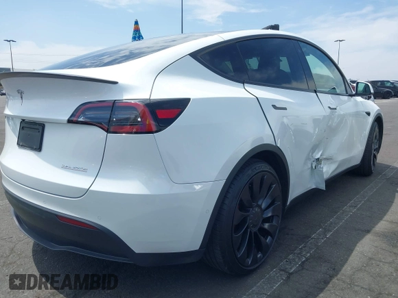 2022 Tesla Model Y Performance with VIN 7SAYGDEF8NF407109, listed as a IAAI auction lot 42014282 with 24,937 mi miles and . Bid and sale history available at DreamBid. Image 4.