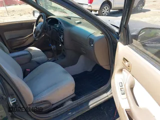 1995 Toyota Camry LE with VIN 4T1GK12E5SU860216, listed as a IAAI auction lot 41803933 with 235,130 mi miles. Bid and sale history available at carsss.com. Image 5.