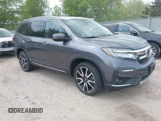 2020 Honda Pilot Elite with VIN 5FNYF6H00LB027472, listed as a IAAI auction lot 42253478 with 69,988 mi miles and . Bid and sale history available at DreamBid. Image 1.