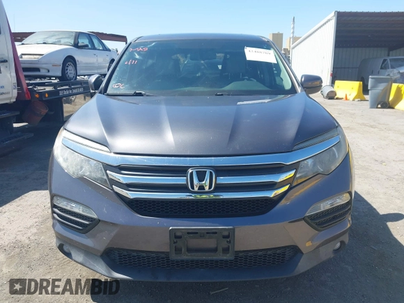 2017 Honda Pilot EX-L with VIN 5FNYF6H59HB032480, listed as a IAAI auction lot 42488789 with 112,595 mi miles and . Bid and sale history available at DreamBid. Image 12.